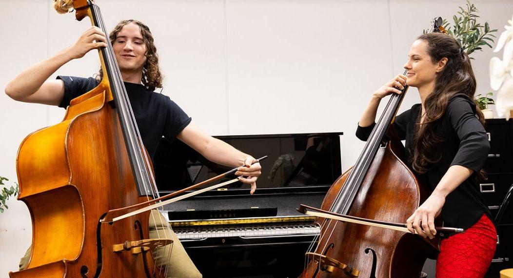 Professor Kathryn Schulmeister and her student during a double bass lesson