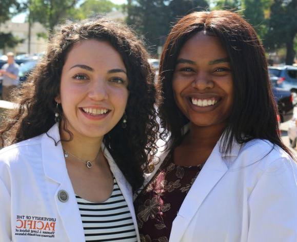 PharmD students in white coats